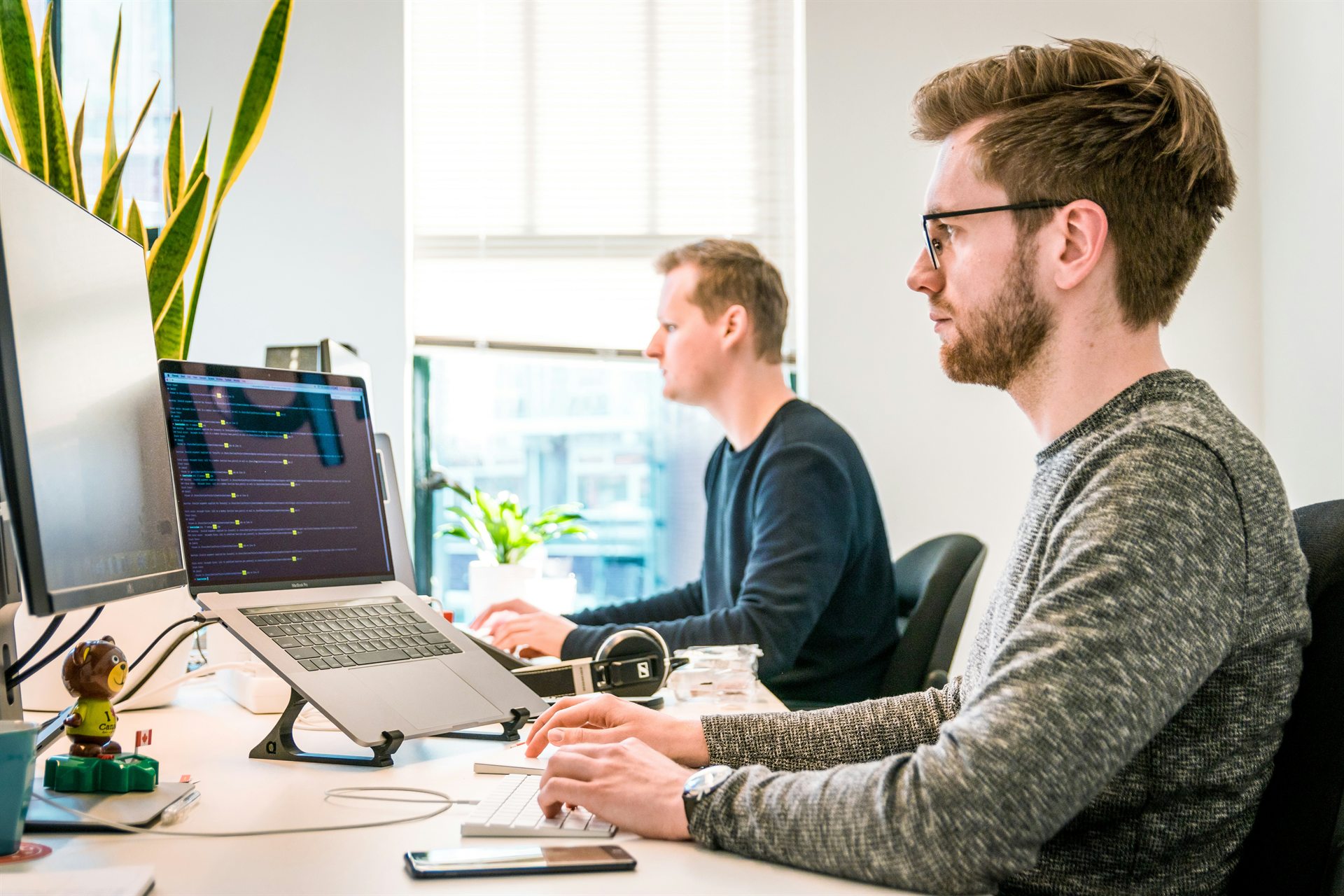 Data professionals working together at a desk